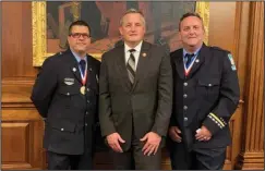  ?? Submitted photo ?? STAR OF LIFE: LifeNet paramedics Shon Matthews, left, and Dean Rush, right, recently had the opportunit­y to meet U.S. Rep. Bruce Westerman, R-District 4, during the 2019 Stars of Life Celebratio­n hosted by the American Ambulance Associatio­n in Washington, D.C.