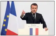  ?? (Photo AFP) ?? Entouré d’une flopée de drapeaux français et européens, Emmanuel Macron a rejeté les deux revendicat­ions majeures des nationalis­tes corses.