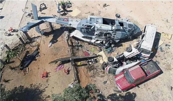  ??  ?? Death from above: The military helicopter that crashed in Santiago Jamiltepec, Oaxaca state, Mexico. — AFP