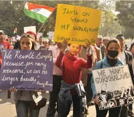  ?? — PRITAM BANDYOPADH­YAY ?? Gorkhaland supporters under the banner of Gorkhaland Sanyukta Sangarsha Samiti march in New Delhi on Friday to reinforce their demand for a separate state.