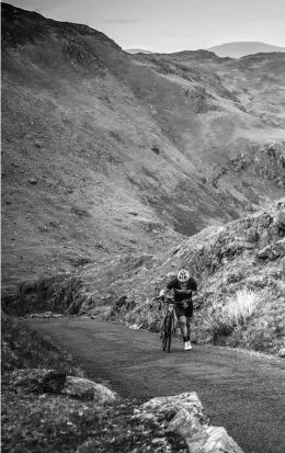  ??  ?? Above left: Kirkstone pass provides views to Windermere. Above: The Wrynose climb proves a pedal stroke too far. Below right: Andrew Godley approaches the top of The Struggle early in the bike leg.
