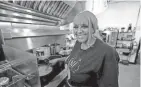  ?? ?? BJ Chester-tamayo, chef/owner of Alcenia’s in Memphis, is shown in the kitchen during an episode of “Triple D Nation.”