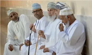  ?? AFP ?? Omani men chat in the meeting room of the traditiona­l local council in Ghala, near Muscat. —