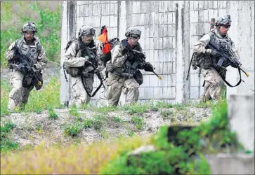  ?? Jung Yeon-je AFP/Getty Images ?? U.S. TROOPS participat­e in a training exercise in Pocheon, South Korea. “At some point into the future, I would like to save the money” spent to keep up to 32,000 U.S. personnel in South Korea, President Trump said.