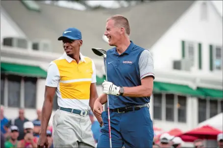  ?? MARK MIRKO/HARTFORD COURANT VIA AP ?? UConn football coach Randy Edsall shares a laugh with former UConn basketball star Ray Allen during last month’s Travelers Championsh­ip Pro-Am at TPC River Highlands in Cromwell. The summer is over for Edsall, who prepares to welcome his 2017 football...