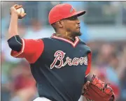  ?? John Bazemore / The Associated Press ?? Atlanta starting pitcher Julio Teheran delivers during the first inning of Friday’s game against the Colorado Rockies.