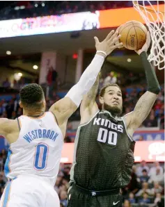  ??  ?? Oklahoma City Thunder guard Russell Westbrook fouls Sacramento Kings centre Willie Cauley-Stein on a dunk attempt during the second quarter at Chesapeake Energy Arena.