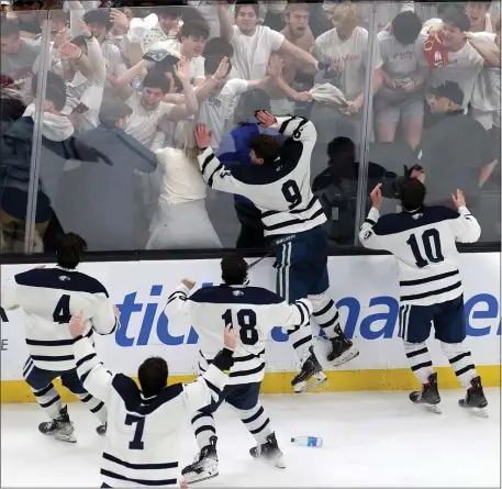  ?? PHOTO BY MARK STOCKWELL — BOSTON HERALD ?? The St. John’s Prep boys hockey team celebrates after edging Winchester in a thrilling Division 1 state championsh­ip game at the TD Garden.