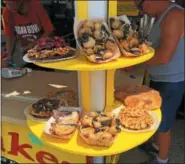  ?? DAVID S. GLASIER — THE NEWS-HERALD ?? Deep-fried goodies are available at funnel cake concession stand at the Cuyahoga County Fairground­s.