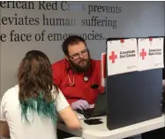  ?? File ?? In this March 2019 file photo, Red Cross employee Justin Dollar makes sure a donor meets the criteria to donate blood.