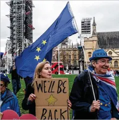  ?? ANDREW TESTA / THE NEW YORK TIMES ?? Anti-Brexit protesters gather outside Parliament in London on Friday as Britain prepared to formally withdraw from the EU.