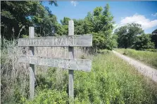  ?? DAX MELMER ?? Mounds of trash were discovered in the Tallgrass Prairie Heritage Park, which is home to at-risk species of snakes.