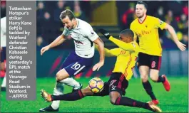  ??  ?? Tottenham Hotspur’s striker Harry Kane (left) is tackled by Watford defender Christian Kabasele during yesterday’s EPL match at the Vicarage Road Stadium in Watford. – AFPPIX from their positive tactics, pushing high up the pitch and forcing mistakes...