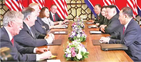  ?? — Reuters photo ?? Kim (sitting second right) and Trump (sitting third left) attend the extended bilateral meeting in the Metropole hotel with US Secretary of State Mike Pompeo, White House National Security Adviser John Bolton, acting White House Chief of Staff Mick Mulvaney, North Korean Foreign Minister Ri Yong Ho and Kim Yong Chol, vice-chairman of the North Korean Workers’ Party Committee, during the second North Korea-US summit in Hanoi,Vietnam.