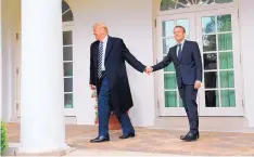  ?? PABLO MARTINEZ MONSIVAIS/ASSOCIATED PRESS ?? President Donald Trump and French President Emmanuel Macron walk to the Oval Office on April 24.