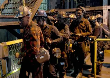  ??  ?? Miners leave the shaft at the Knurow mine after a night shift in Knurow, in Poland’s southern mining region of Silesia. — AFP photo