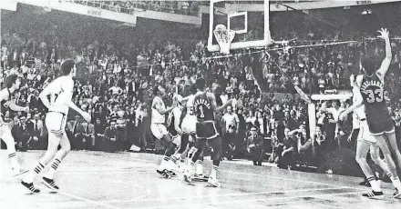  ?? JOURNAL SENTINEL FILES ?? Milwaukee’s Kareem Abdul-Jabbar, far right, sinks the winning basket to defeat the Boston Celtics, 102-101, at the Boston Garden to tie the NBA Finals at 3-3 in 1974.