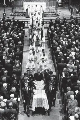  ?? Associated Press ?? ■ Pallbearer­s escort the casket of former first lady Barbara Bush after her funeral Saturday at St. Martin's Episcopal Church in Houston.