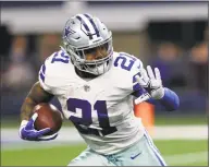  ?? Roger Steinman / Associated Press ?? Cowboys running back Ezekiel Elliott runs the ball against the Buccaneers on Dec. 23.