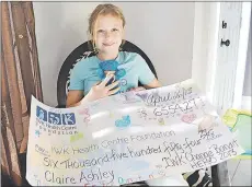  ?? TC MEDIA PHOTO ?? Claire Ashley proudly displays the souvenir cheque she received in recognitio­n of her fundraisin­g for the IWK Children’s Hospital. The eight-year-old Northport girl is still raising money for the hospital she’s been attending regularly since she was two.