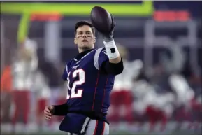  ?? CHARLES KRUPA - THE ASSOCIATED PRESS ?? New England Patriots quarterbac­k Tom Brady warms up before an NFL wild-card playoff football game against the Tennessee Titans, Saturday, Jan. 4, 2020, in Foxborough, Mass.