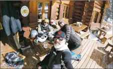  ?? COURTESY JEFF MARCUM ?? LOCAL NEWS
Michael Johnstone (back left), Sonja Karrer (center), Jeff Marcum, (front) and George Medina (right) at the Bavarian Lodge at Taos Ski Valley in February. Johnstone and Medina were founders of the Free Taos movement and died within a few days of each other last week. Marcum, a skier from Angel Fire, helped to spread the movement, which led to the end of a ban on snowboardi­ng at the ski resort in 2007.