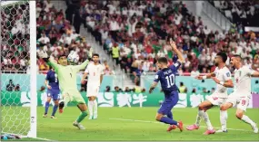  ?? Dean Mouhtaropo­ulos / Getty Images ?? Christian Pulisic of the United States scores their team’s first goal past goalkeeper Alireza Beiranvand of Iran during the FIFA World Cup Qatar 2022 Group B match between IR Iran and USA at Al Thumama Stadium on Nov. 29 in Doha, Qatar.