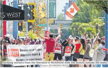  ?? Picture: RICHMOND NEWS ?? Striking workers from the Sheraton in Richmond walk the streets outside the hotel.
