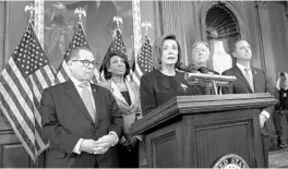  ?? J. SCOTT APPLEWHITE/AP ?? Speaker of the House Nancy Pelosi and other House leaders announce they are pushing ahead with two articles of impeachmen­t against President Donald Trump — abuse of power and obstructio­n of Congress.