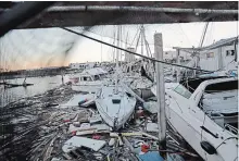  ?? DAVID GOLDMAN
THE ASSOCIATED PRESS ?? Damaged boats sit among debris in a marina in the aftermath of hurricane Michael in Panama City, Fla., on Friday.