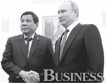  ?? PCOO ?? President Rodrigo Duterte (left) meets with Russian President Vladimir Putin at the Kremlin in Moscow prior to his premature return to the Philippine­s to attend to the Marawi City siege on May 24.