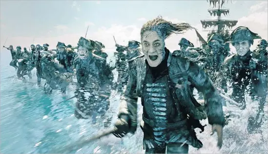  ?? Disney / Film Frame ?? JAVIER BARDEM as villainous Capt. Salazar leads his ghostly seafaring crew through the surf in Disney’s new “Pirates of the Caribbean: Dead Men Tell No Tales.”