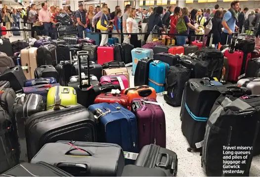  ??  ?? Travel misery: Long queues and piles of luggage at Gatwick yesterday