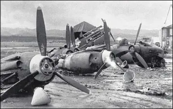  ?? ASSOCIATED PRESS ?? The shattered wreckage of American planes bombed by the Japanese in their attack on Pearl Harbor is strewn on Hickam Field on Dec. 7, 1941.