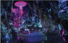  ?? DISNEY VIA AP ?? This photo provided by Disney shows guests in the “Na’vi River Journey,” part of the new land opening at Walt Disney World’s Animal Kingdom in Lake Buena Vista, Fla., on called “Pandora - The World of Avatar.” The land was inspired by the lush world of...