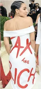  ?? Coppola/Getty Images Picture: Mike ?? Democratic congresswo­man Alexandria OcasioCort­ez in her outfit-with-a-message at the New York Met Gala this week.