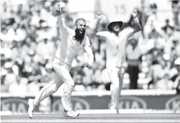  ??  ?? England’s Moeen Ali celebrates the wicket of South Africa’s Chris Morris for 24 on the fifth and final day of the third Test match between England and South Africa at The Oval cricket ground in London. - AFP photo