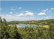  ??  ?? At Eagle Ridge, buyers can get their wooded, 10-acre, lake-access estate with Hill Country and lake views, on sale, for $179,900.