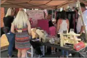  ?? NICHOLAS BUONANNO — NBUONANNO@TROYRECORD.COM ?? Attendees browse through items for sale at a vendor during the 4th annual Spring Fest.