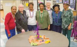  ?? MARK BUFFALO/THREE RIVERS EDITION ?? Patrons of the Jacksonvil­le Senior Wellness and Activity Center wear beads and hats to show their support for the upcoming Taste of New Orleans fundraiser, set for Feb. 28 at the Jacksonvil­le Community Center. Pictured are, from left, Ann Hammons, Sonny Meriedeth, Shirley Jackson, Ruthie Ford, Dorthy DeJesus, Gracie Kelley and Dorothy Rutledge.