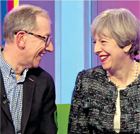  ??  ?? Theresa May with husband Philip on BBC One’s The One Show, where host Alex Jones asked him if he ‘fancied her instantly’, to which Mr May replied: ‘It was love at first sight’