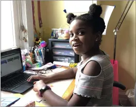  ?? SUBMITTED PHOTO ?? Media-Providence Friends School fourth-grade student Katie GephartHal­l joins her class on her Chromebook as part of the school’s distance learning program.