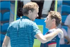  ?? - AFP photo ?? Daniil Medvedev of Russia (L) chats with Casper Ruud of Norway at the net after he defeated him in their ninth session men's singles match on day five of the ATP Cup tennis tournament in Perth.