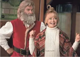  ?? JOSEPH LEDERER/NETFLIX ?? Santa Claus (Russell) and Mrs. Claus (Goldie Hawn) team up with some youngsters to save Christmas in the Netflix sequel “The Christmas Chronicles 2.”