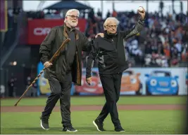  ?? KARL MONDON — BAY AREA NEWS GROUP FILE ?? Giants longtime broadcaste­rs Mike Krukow and Duane Kuiper arrive to throw out the first pitch before Game 1 of the National League Division Series at Oracle Park in San Francisco on Oct. 8, 2021.