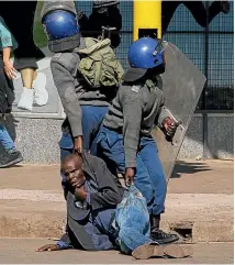  ?? GETTY ?? Right, police detain an antigovern­ment protester last month. The enthusiasm that greeted President Emmerson Mnangagwa’s coup only two years ago has vanished.