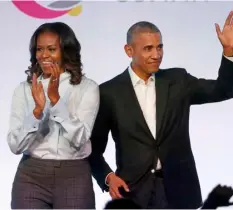  ?? AP Photo/Charles Rex Arbogast ?? In this 2017 file photo, former President Barack Obama (right) and former first lady Michelle Obama appear at the Obama Foundation Summit in Chicago.