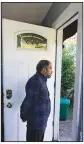  ?? ?? Abdul looks Thursday out the doorway of a rental house, where his family has been provided a place to stay in Seattle.