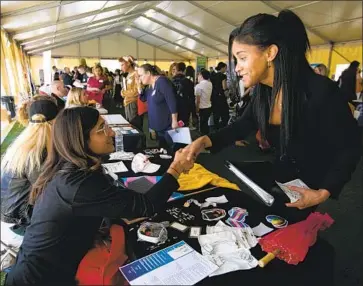  ?? FRANCINE ORR Los Angeles Times ?? CALIFORNIA’S LABOR market has been surprising­ly resilient despite the U.S.-China trade war and global manufactur­ing recession, one economist says. Above, a job fair at Los Angeles Trade-Tech College in March.