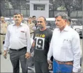  ?? Handout ?? Accused Mahesh Goyal (centre) in police custody.